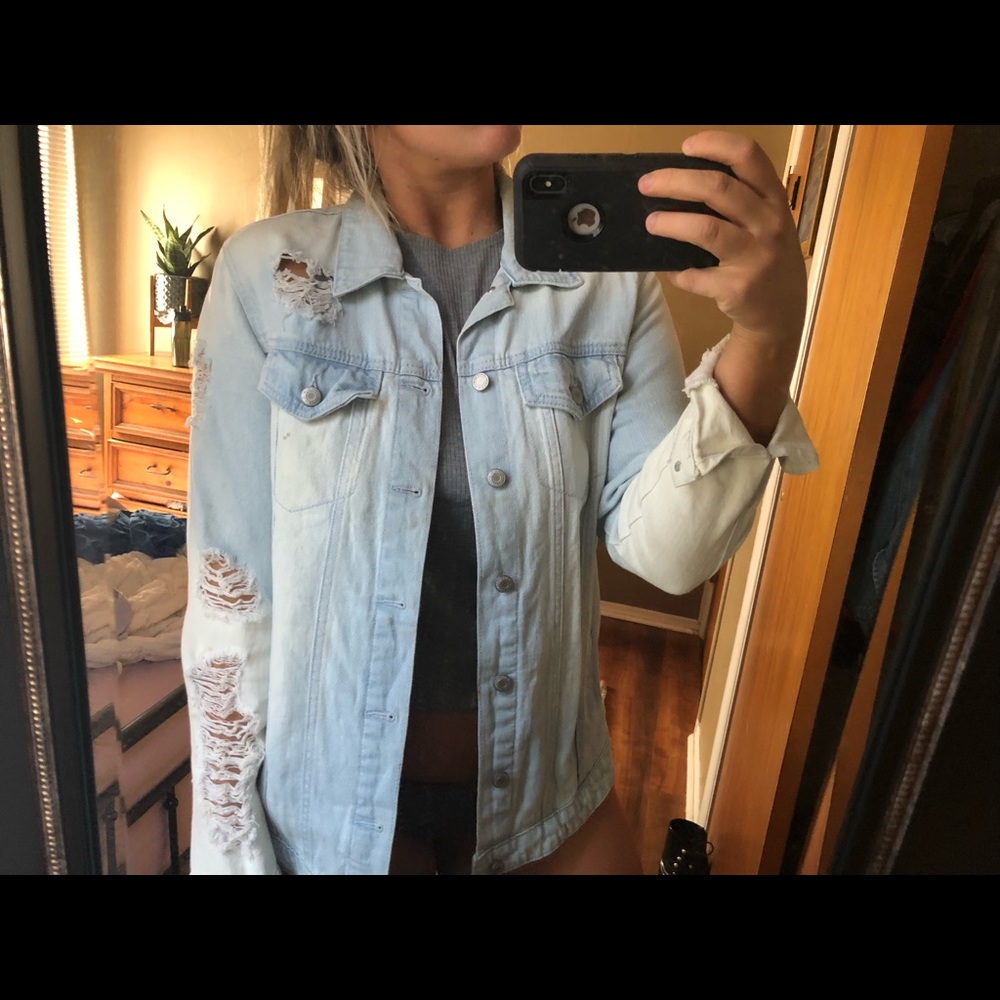 Distressed blue jean jacket